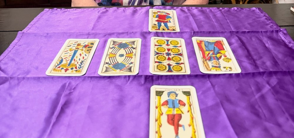 Christine's tarot spread laid out on a purple cloth